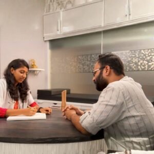 Doctor consulting patient at Homoeopathic Healing Centre during case discussion