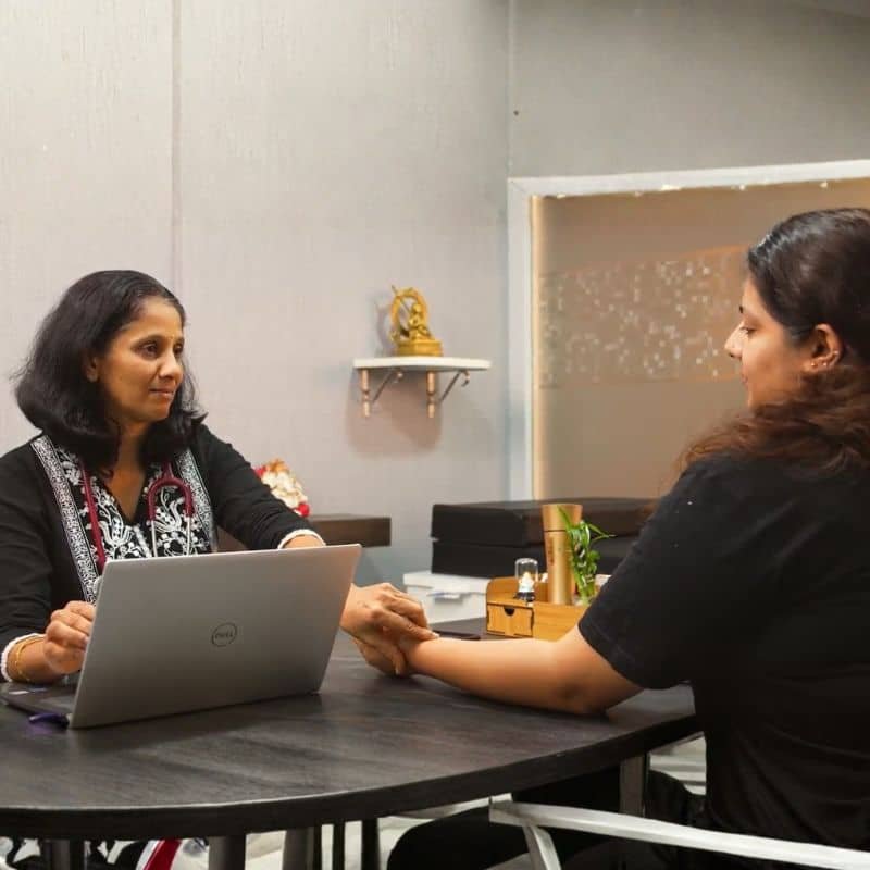 Dr. Jayshree consulting patient at Homoeopathic Healing Centre during case discussion
